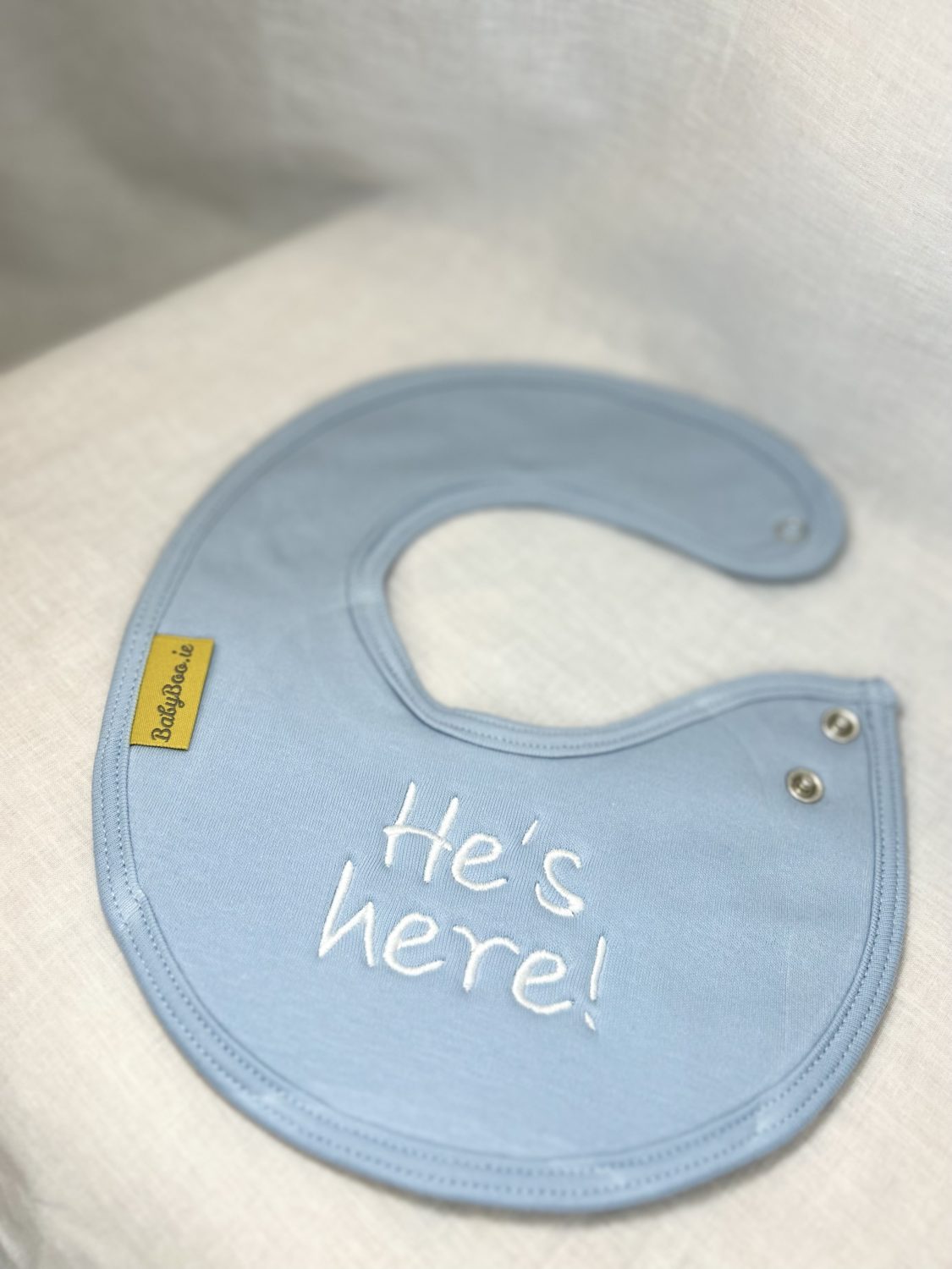 He's Here! organic cotton LittleBoo newborn bib