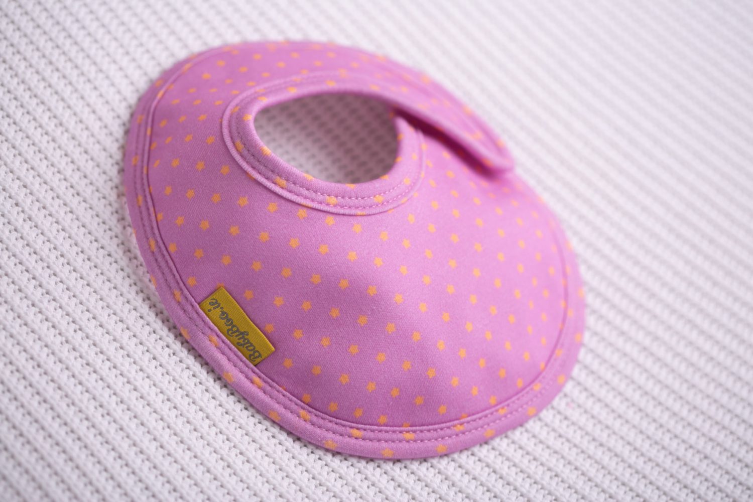 Plum with orange superstars organic cotton LittleBoo baby bib