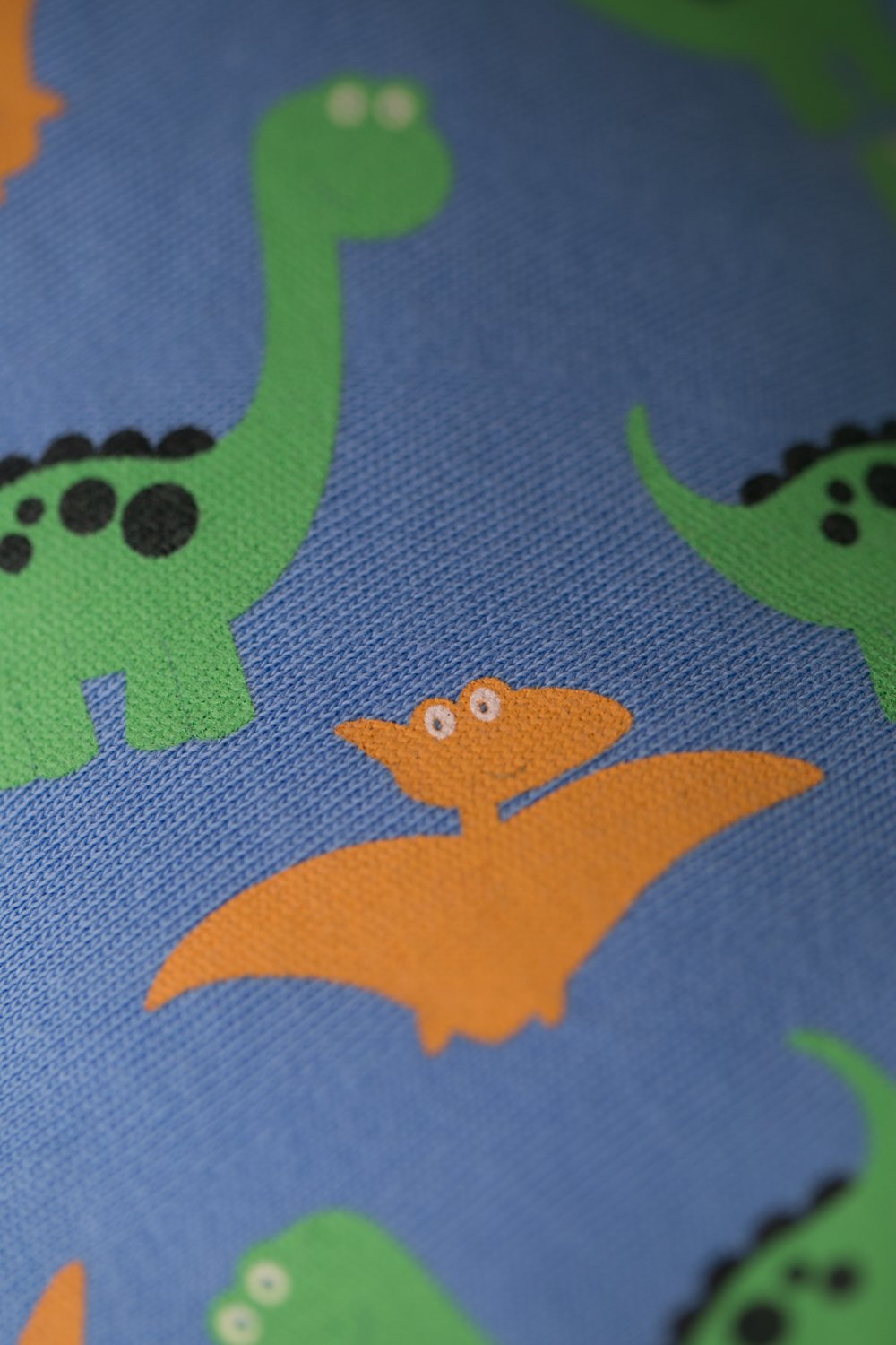Blue dinos everywhere organic cotton DribbleBoo bandana bib
