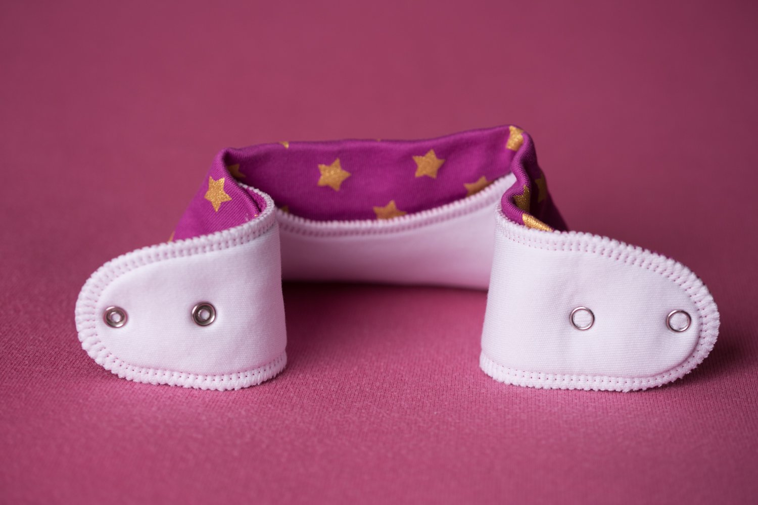 Plum with golden stars organic cotton DribbleBoo bandana bib