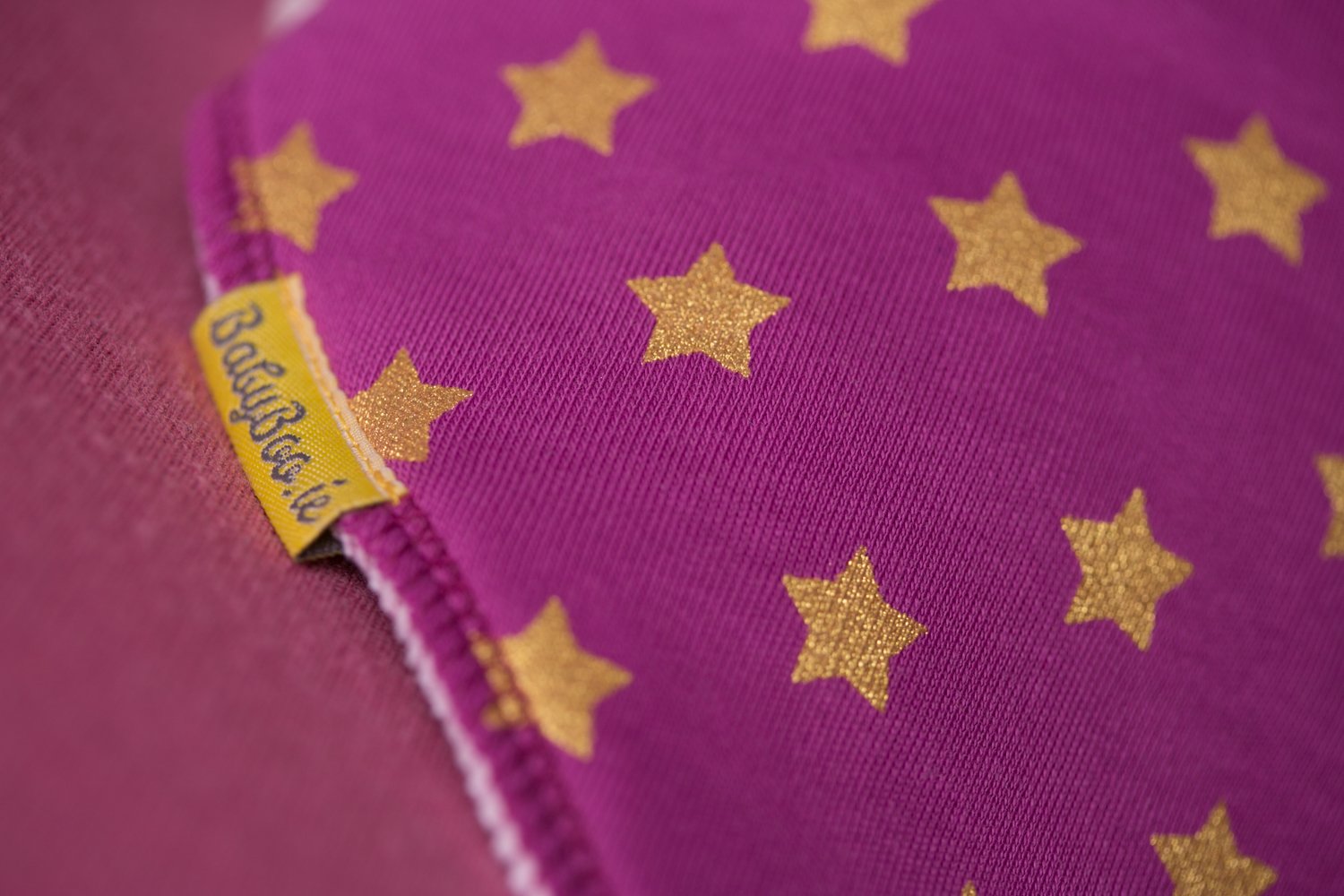 Plum with golden stars organic cotton DribbleBoo bandana bib