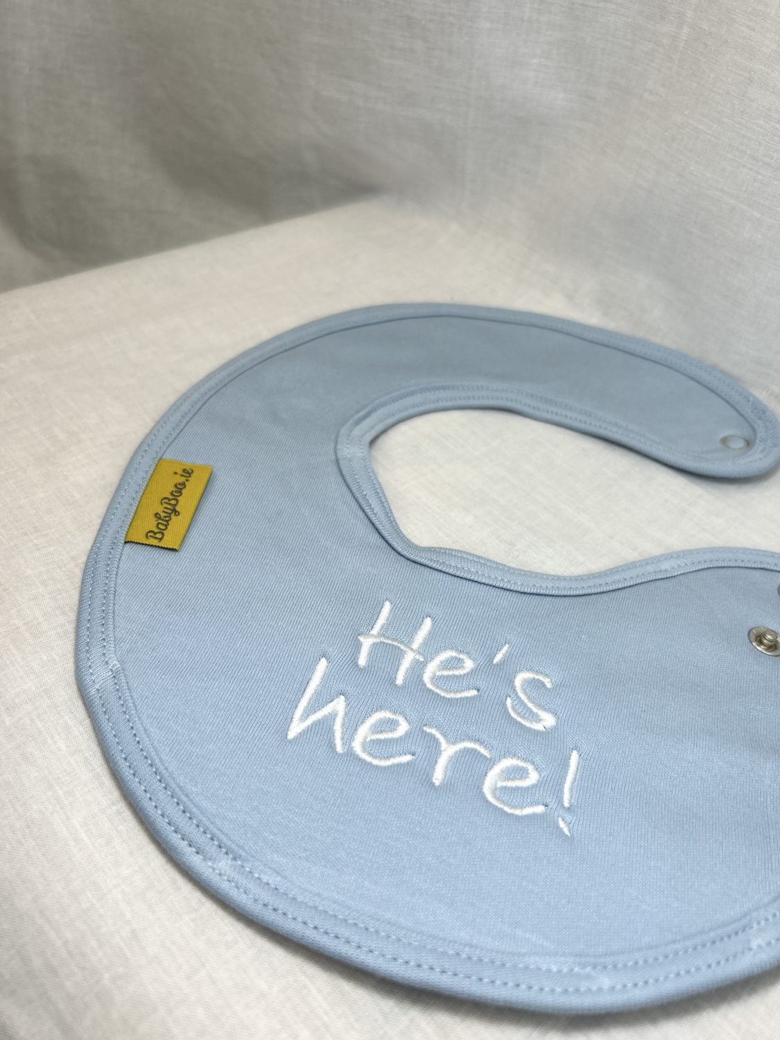 He's Here! organic cotton LittleBoo newborn bib