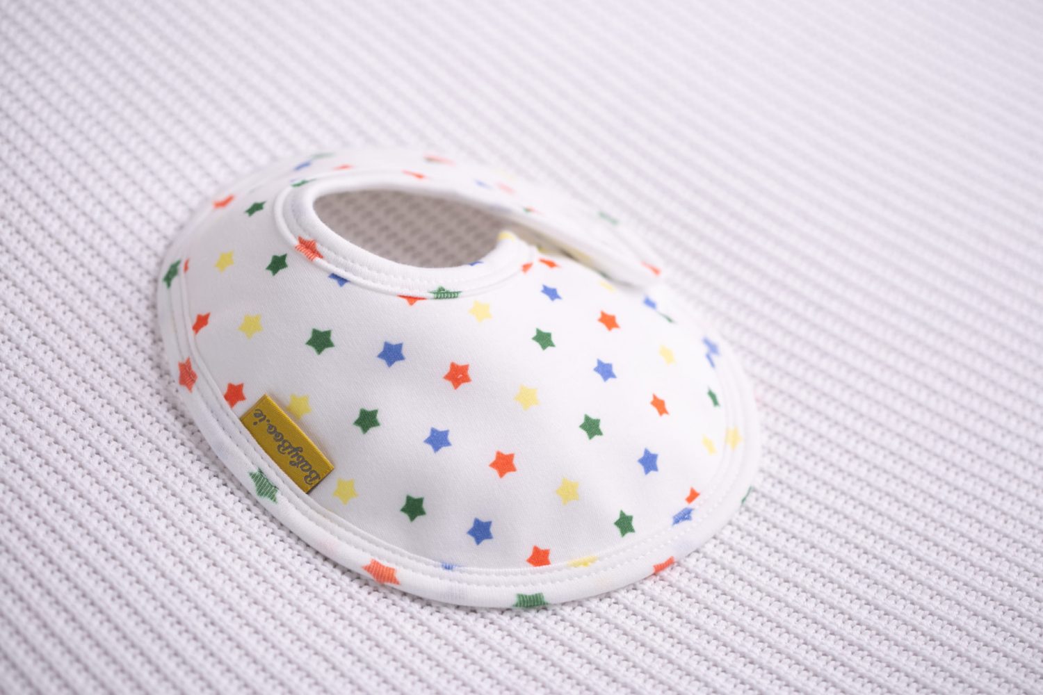 Rainbow stars organic cotton LittleBoo baby bib