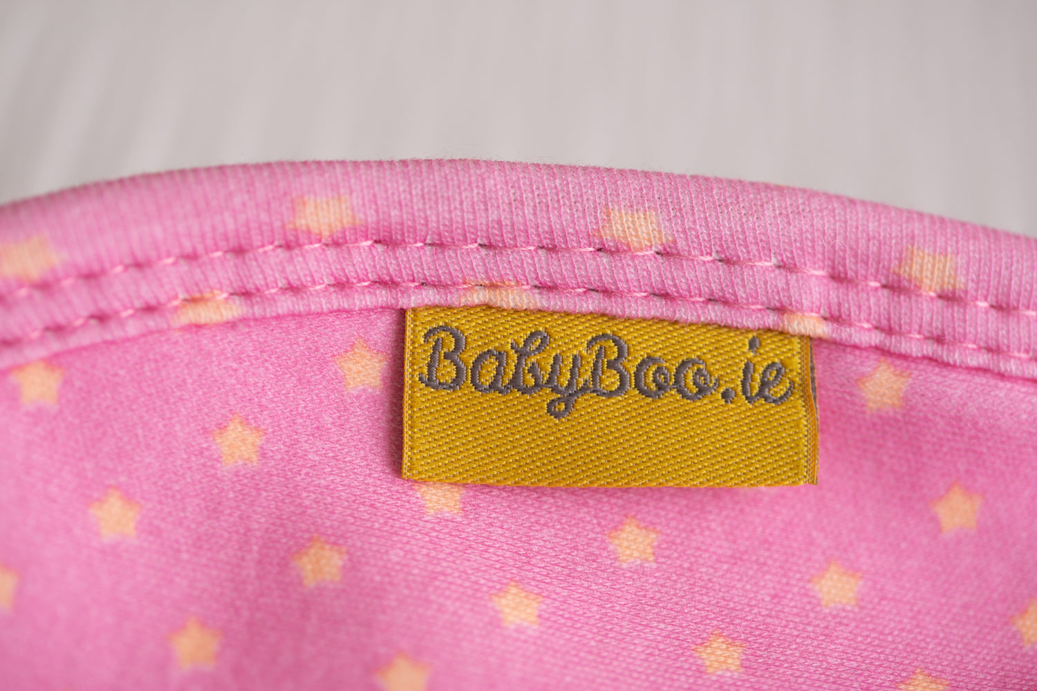 Pink with sunshine stars organic cotton LittleBoo baby bib