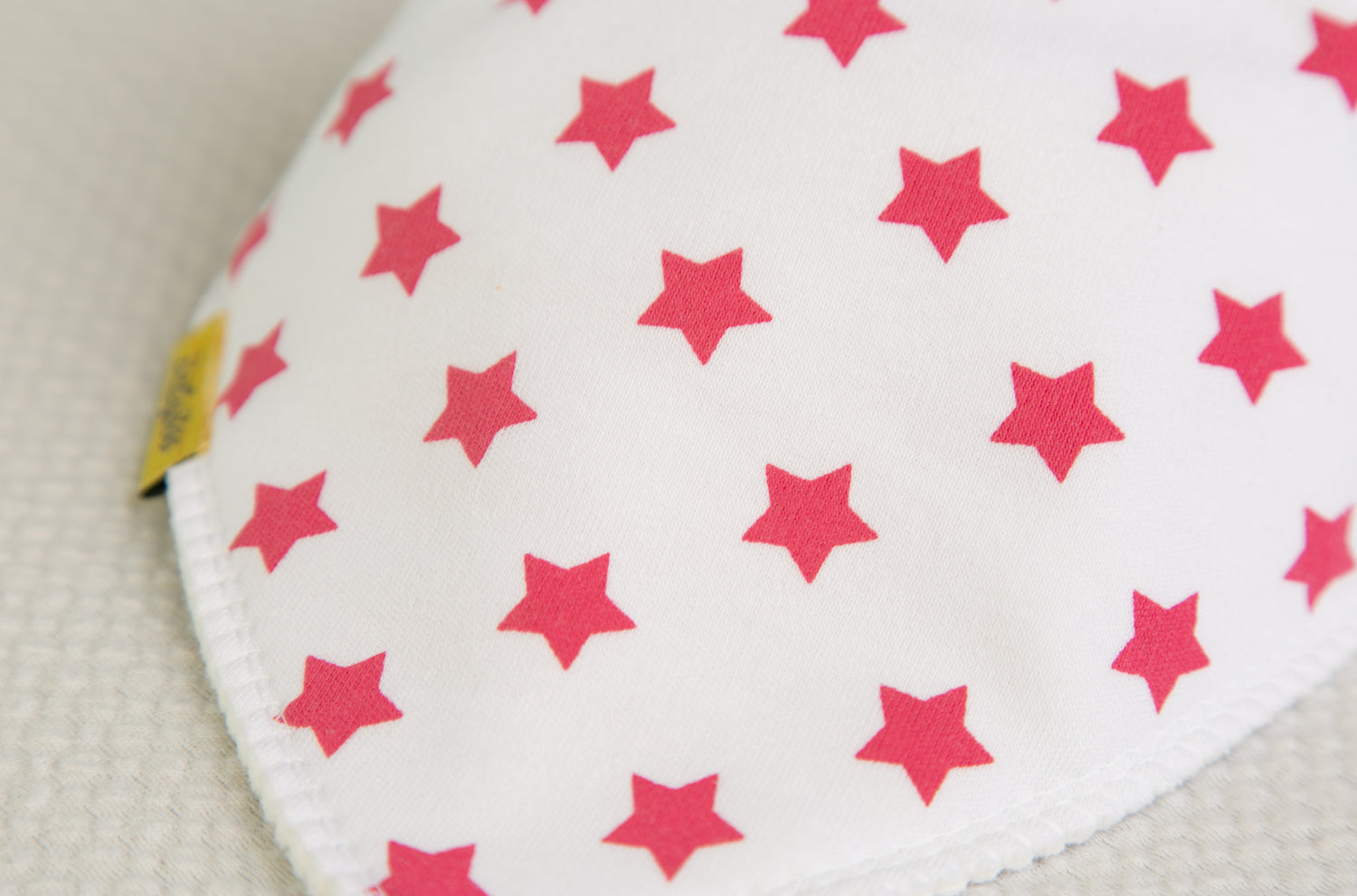 White with hot pink stars organic cotton DribbleBoo bandana bib