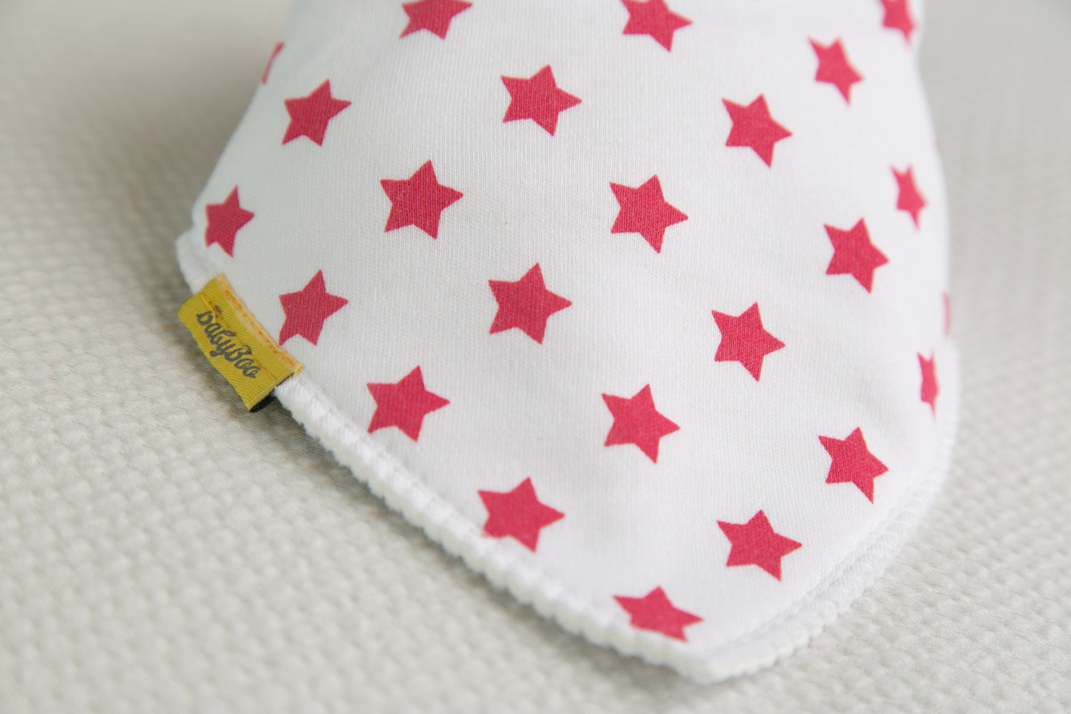 White with hot pink stars organic cotton DribbleBoo bandana bib