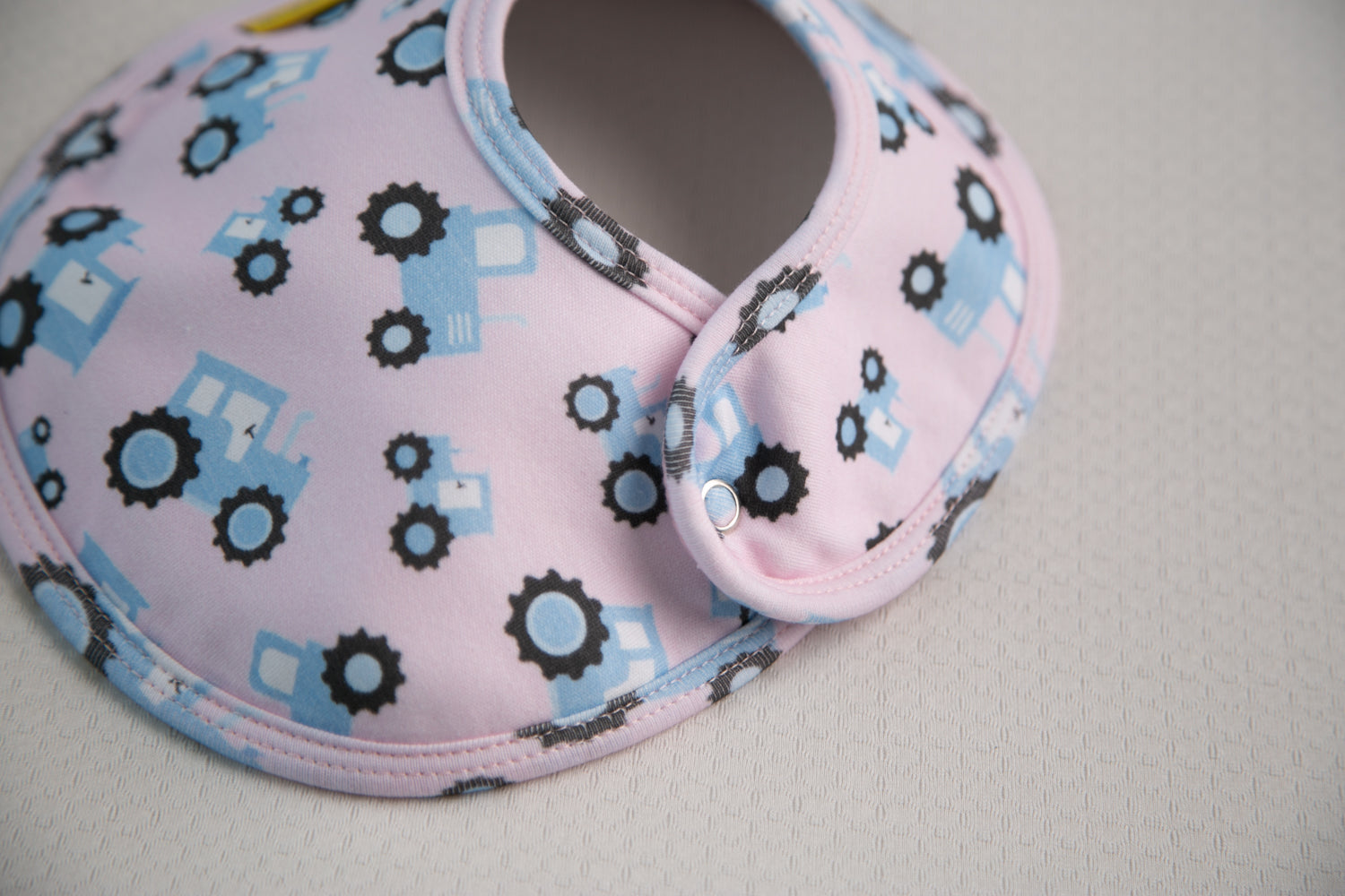 Pink with blue tractors organic cotton LittleBoo baby bib