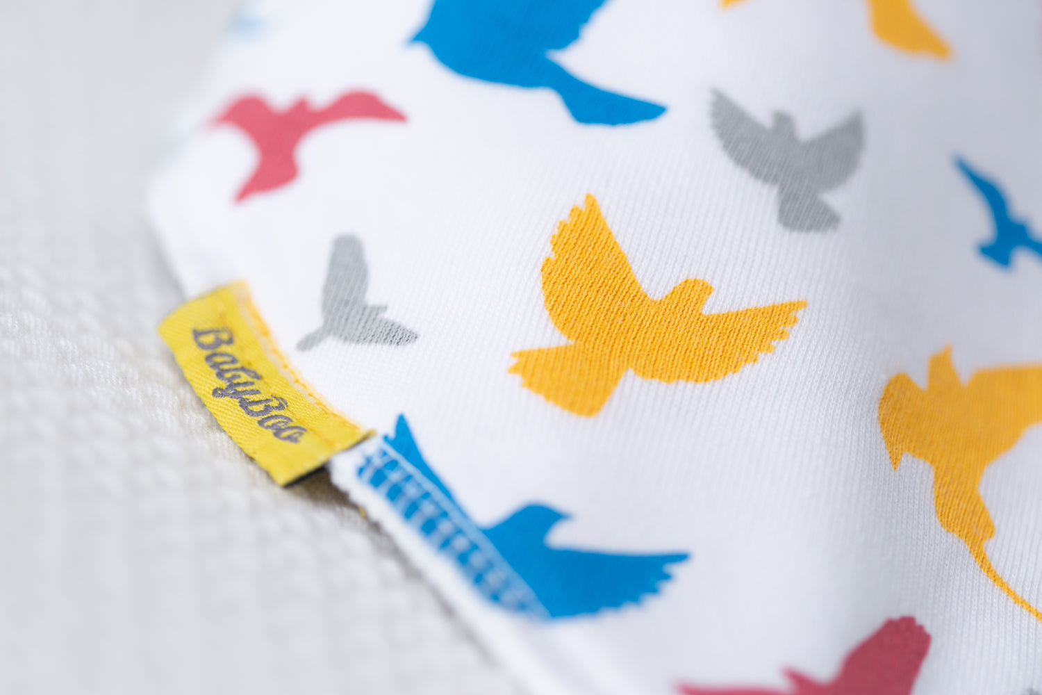Colourful birds organic cotton DribbleBoo bandana bib