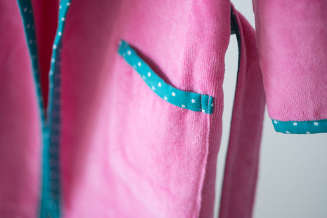 Pink with teal stars organic cotton robe - piping detail