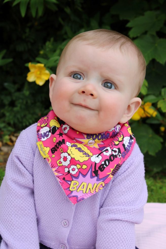 Pink Superhero organic cotton DribbleBoo bandana bib - Image 2