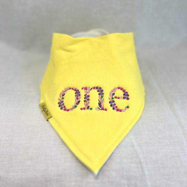 Floral "ONE" birthday organic cotton Dribbleboo bandana bib - Image 2