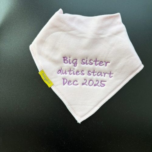 Big sister duties start Dec 2026 organic cotton DribbleBoo bandana bib