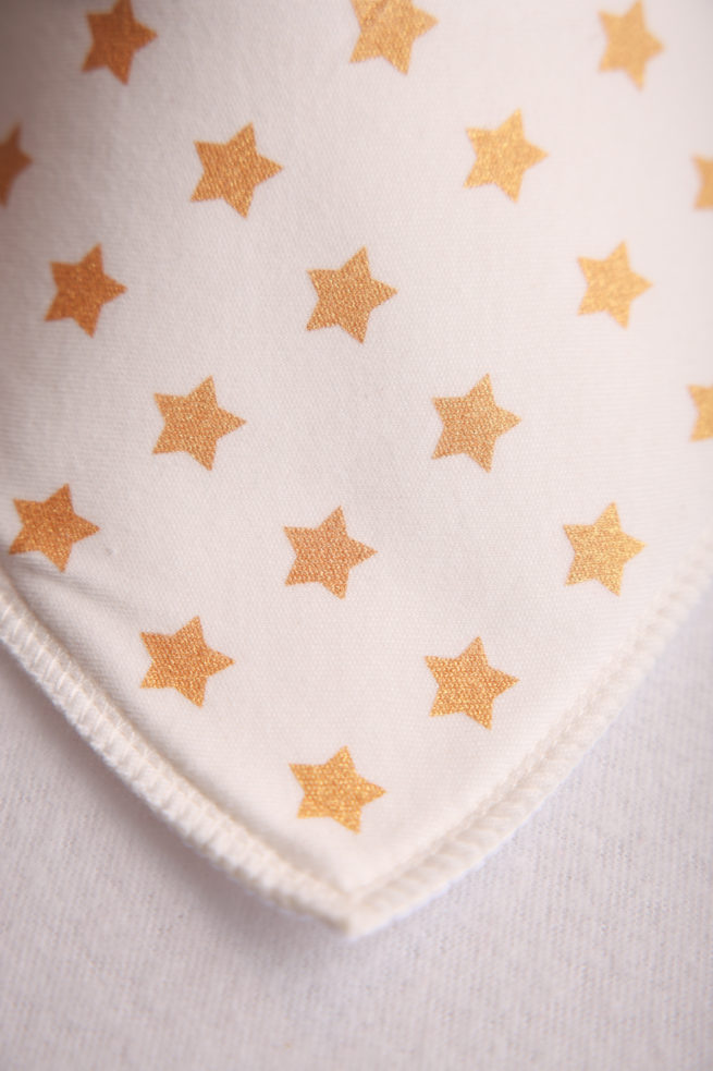 Gold stars on cream organic cotton DribbleBoo bandana bib - Image 2